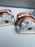 Three ceramic figurines: salt and pepper shakers pink-roofed houses and a brick-tower scene - thumbnail 4 of 5