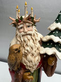Santa Claus statue with candle wreath, owl, and snow-covered tree - thumbnail 2 of 4