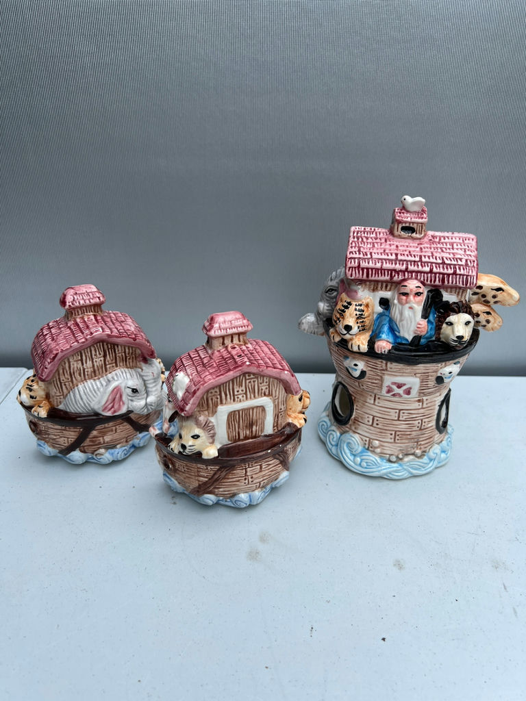 Three ceramic figurines: salt and pepper shakers pink-roofed houses and a brick-tower scene - image 1 of 5