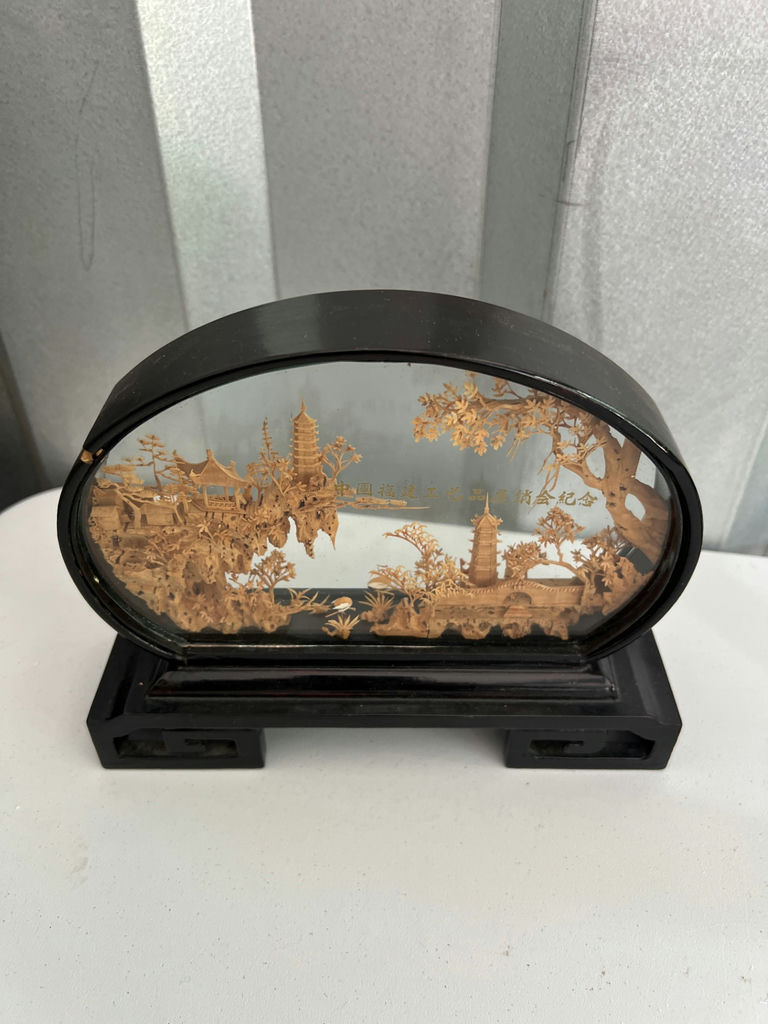 Geisha figurine, oval landscape plaque, and two painted eggs in glass display - image 3 of 6