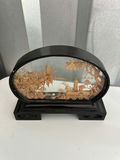 Geisha figurine, oval landscape plaque, and two painted eggs in glass display - thumbnail 3 of 6