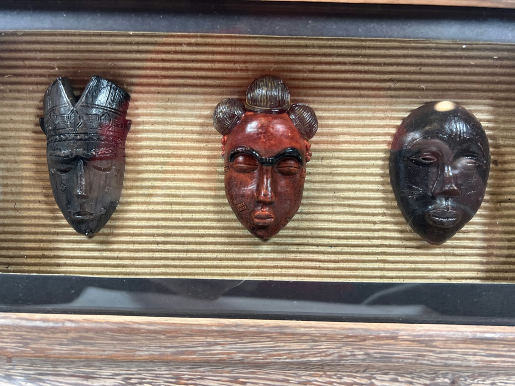 Three carved masks in a rustic framed display - image 2 of 3
