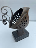 Rusty metal bird sculpture on a black pedestal - thumbnail 2 of 3