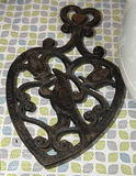 Rice Cooker, Barbecue Serving Tray, Decorative Tin, Cast Iron Trivet, and Cake Template - thumbnail 2 of 5