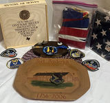 Military Memorabilia Collection with Flags, Patches, Wooden Plaque, and Decorative Plate - thumbnail 1 of 9