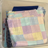Storage Bins of Fabric, Linens, and Wrinkle Blanket - thumbnail 9 of 13