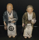Pair of Asian Figurines in Traditional Clothing - thumbnail 1 of 4