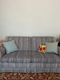 Blue striped sleep sofa with decorative throw pillows - thumbnail 1 of 2