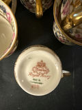 Bohemian porcelain teacups, saucers, and plate with floral and gold trim - thumbnail 3 of 3