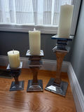 Set of three metal pillar candle holders with candles - thumbnail 2 of 2