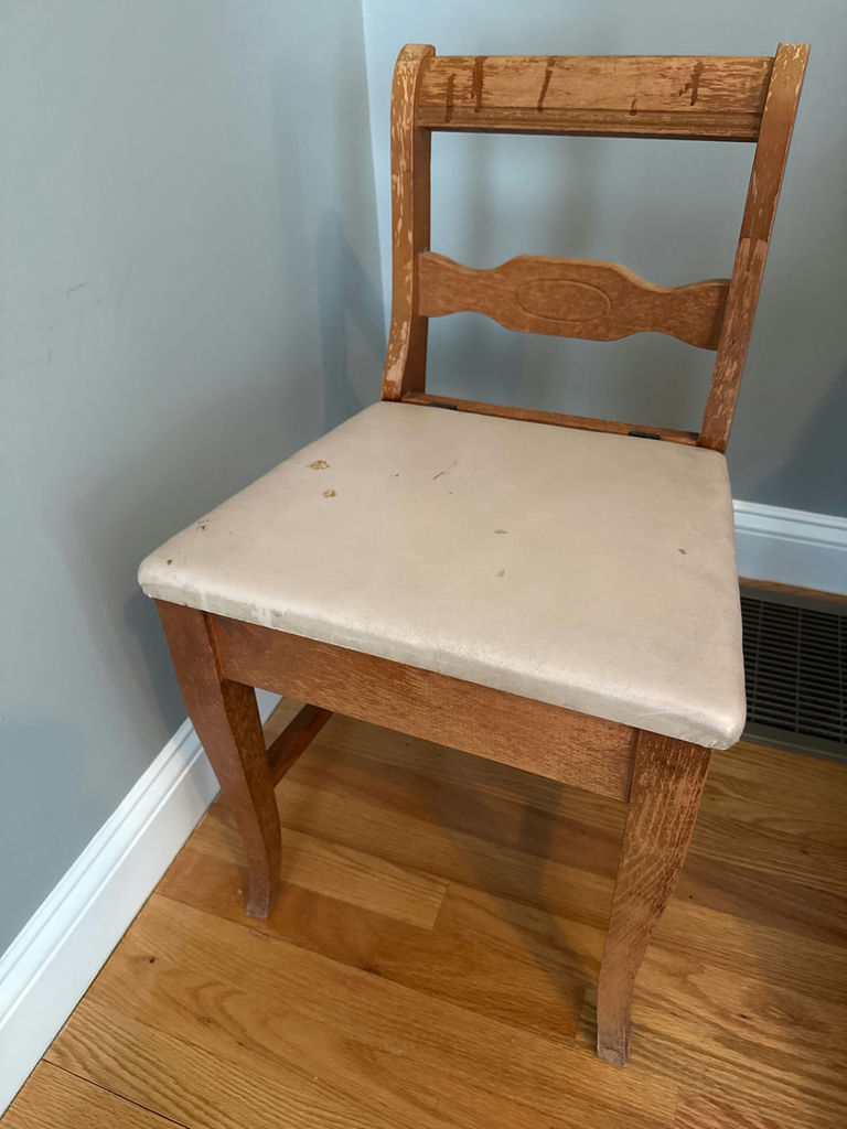 Distressed wooden chair with upholstered leather seat - image 1 of 3