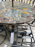 Round mosaic patio table with umbrella and metal chairs - thumbnail 2 of 4