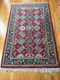 Hand-tufted wool rug with burgundy field and ornate border - thumbnail 2 of 5