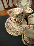 Bohemian porcelain teacups, saucers, and plate with floral and gold trim - thumbnail 2 of 3