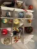Assorted Christmas ornaments in a multi-compartment storage box - thumbnail 2 of 4