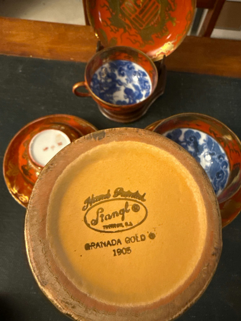 Orange-red porcelain teacups with blue interiors, matching saucers and plate, plus a gold vase - image 4 of 4