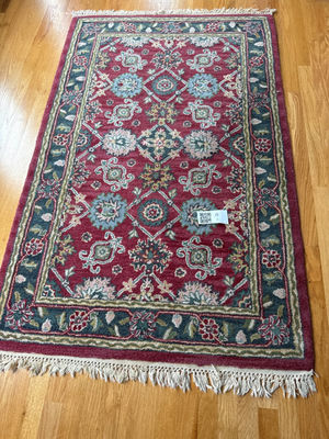 Hand-tufted wool rug with burgundy field and ornate border - Image 1 of 5