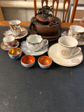 Assorted porcelain teacups, saucers, and small bowls - thumbnail 1 of 7