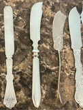 Assorted Silver Flatware Knives and Spreaders - thumbnail 2 of 12