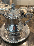Silver-plated serving pieces including teapot, sugar dish, rectangular tray, and wire fruit basket - thumbnail 5 of 6