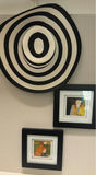 Two framed prints and a black & white striped woven hat. - thumbnail 2 of 7