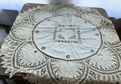 Vintage lace doilies, tablecloths, and embroidered linens - Image 1 of 9