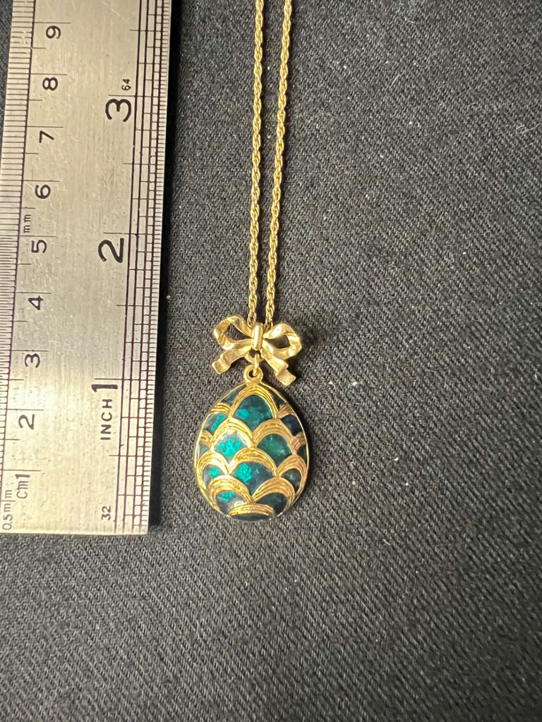 Three necklaces: gold-tone pendant necklace, silver-toned necklace, and multicolor beaded necklace - image 5 of 11