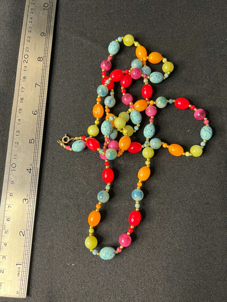 Three necklaces: gold-tone pendant necklace, silver-toned necklace, and multicolor beaded necklace - image 9 of 11