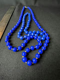 Beaded necklace collection in blue, black and gold tones - thumbnail 1 of 12