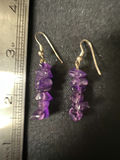 Gold-tone cameo pendant necklace with floral center, purple chip earrings, and two-tone circular earrings - thumbnail 7 of 11