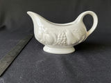 Vintage ceramic grape-pattern gravy boat, and blue embossed glass jar - thumbnail 1 of 7