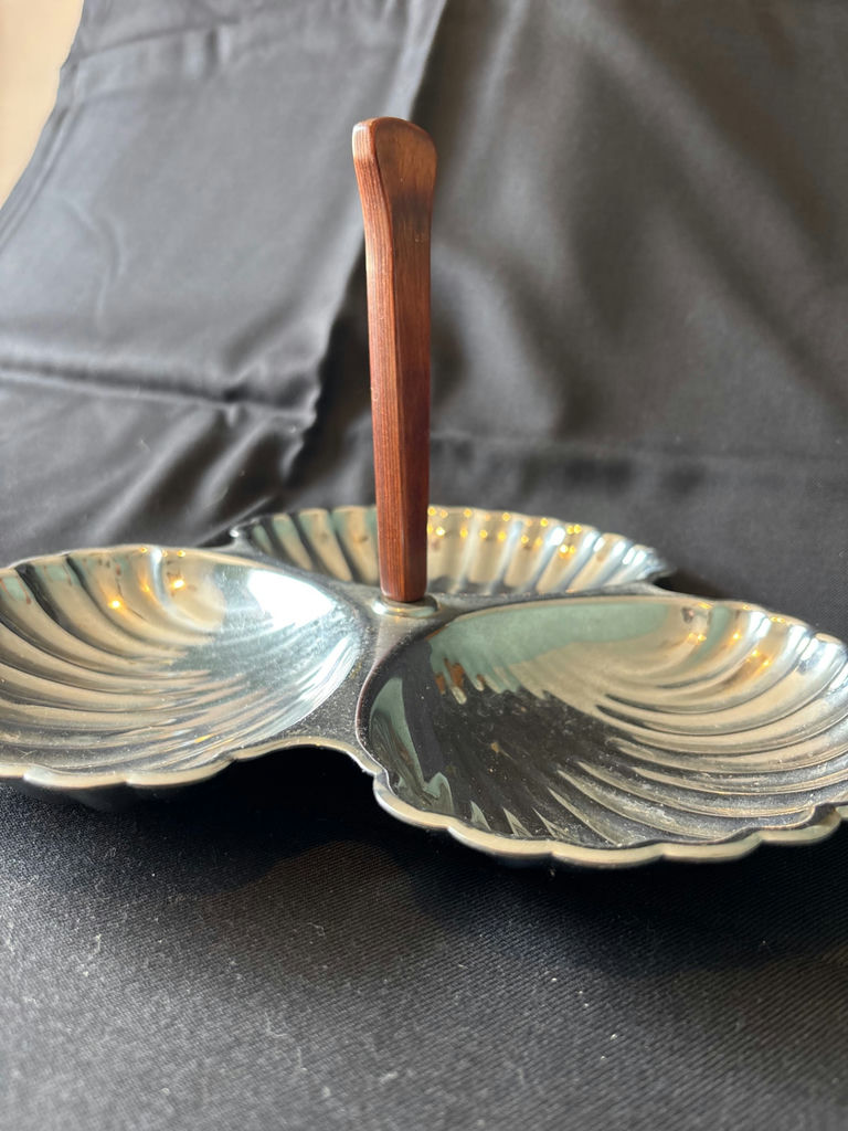 Vintage three-section shell-shaped serving dish with wooden handle, antique creamer pitcher, and embossed glass plate - image 1 of 8