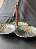 Vintage three-section shell-shaped serving dish with wooden handle, antique creamer pitcher, and embossed glass plate - thumbnail 1 of 8