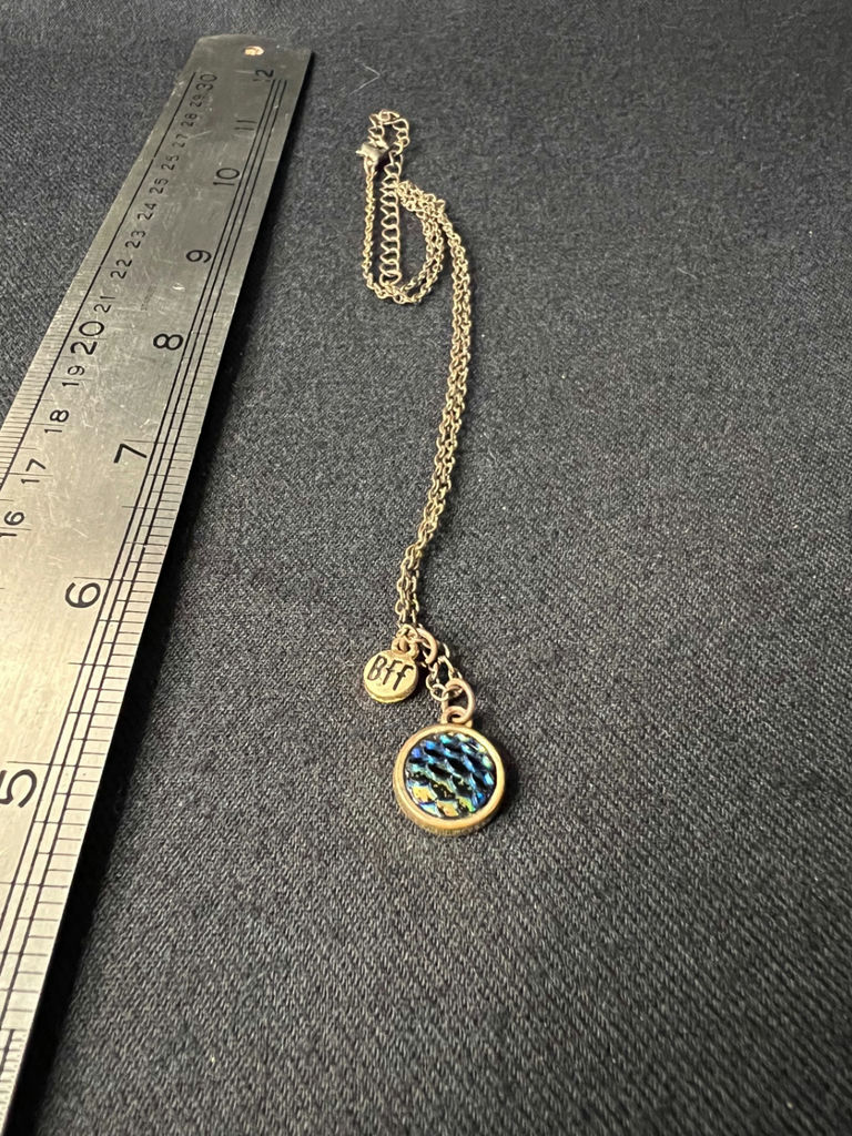 Silver-toned necklace with iridescent round pendant and 'BFF' charm - image 1 of 6