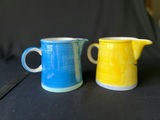 Pair of small ceramic pitchers with blue and yellow floral glaze - thumbnail 4 of 4