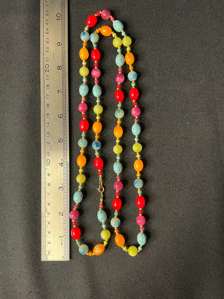Three necklaces: gold-tone pendant necklace, silver-toned necklace, and multicolor beaded necklace - image 11 of 11