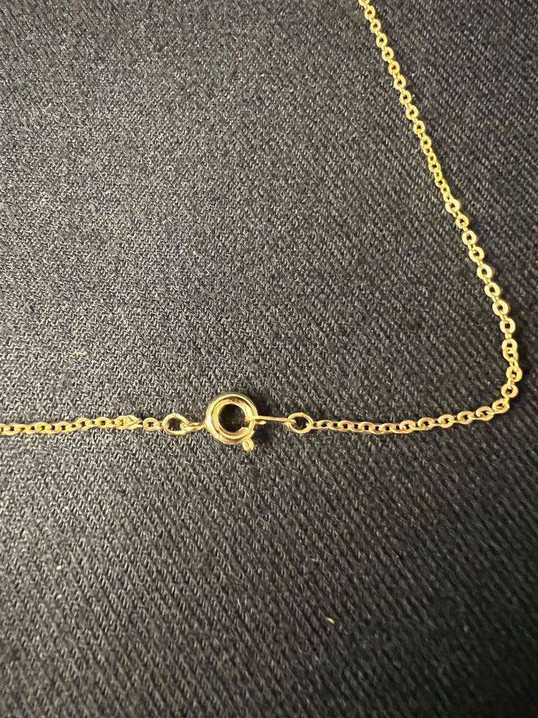 Gold-tone jewelry collection with heart pendant, charm bracelet, and drop earrings - image 4 of 18