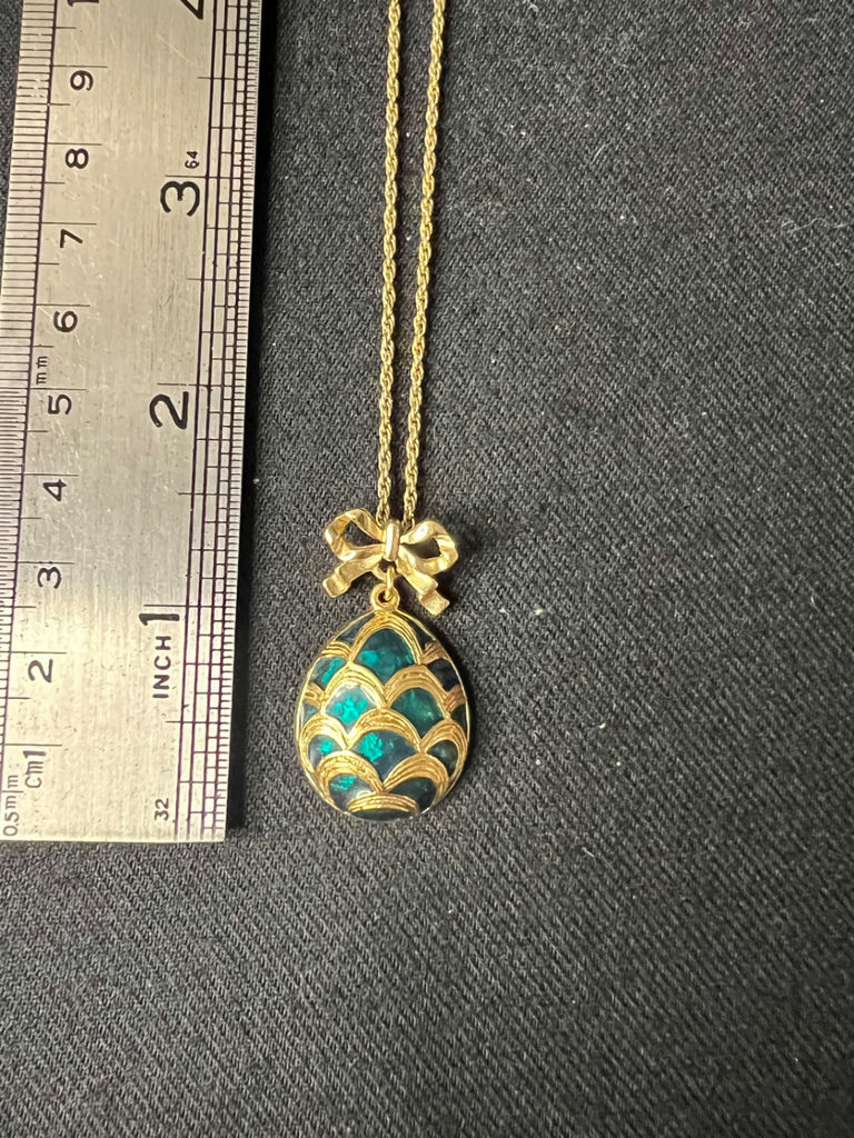 Three necklaces: gold-tone pendant necklace, silver-toned necklace, and multicolor beaded necklace - image 6 of 11