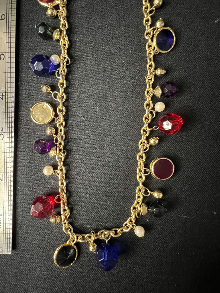 Gold-tone beaded necklace with multicolored charms and red enamel crescent earrings - image 3 of 8