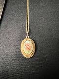 Gold-tone cameo pendant necklace with floral center, purple chip earrings, and two-tone circular earrings - thumbnail 4 of 11