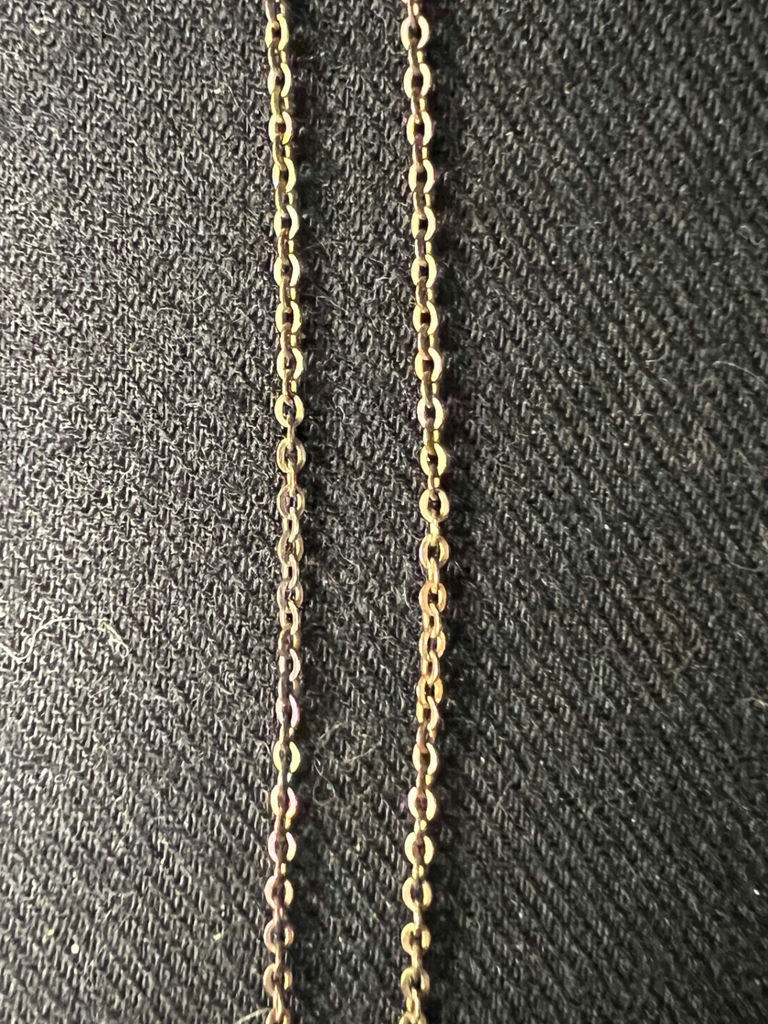 Three necklaces: gold-tone pendant necklace, silver-toned necklace, and multicolor beaded necklace - image 2 of 11