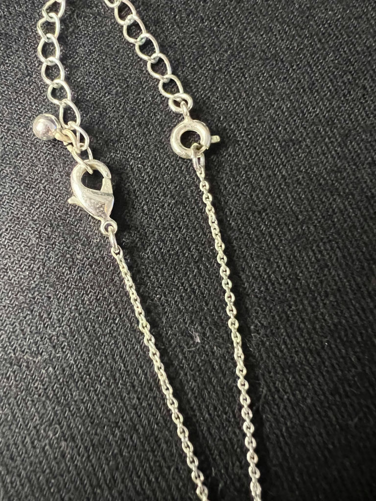 Silver-tone necklace with crystal drop pendant and one pair of shell earrings (blue enamel and gold-tone) - image 3 of 6