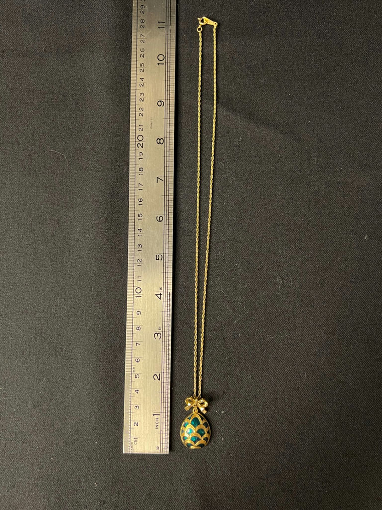 Three necklaces: gold-tone pendant necklace, silver-toned necklace, and multicolor beaded necklace - image 4 of 11