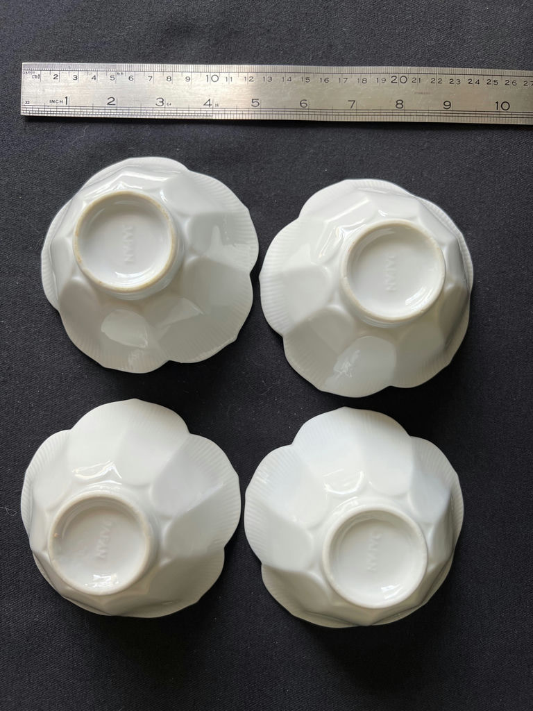 Ceramic dishware set with scalloped bowls and decorative plates - image 1 of 8