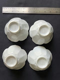 Ceramic dishware set with scalloped bowls and decorative plates - thumbnail 1 of 8