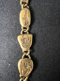 Gold-tone bracelet with engraved shield links, beaded hoop earrings, and a wire bow ornament - thumbnail 6 of 10