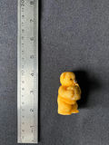 Yellow teddy bear figurine holding a honey jar - thumbnail 2 of 8