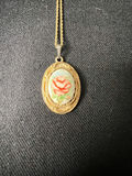 Gold-tone cameo pendant necklace with floral center, purple chip earrings, and two-tone circular earrings - thumbnail 1 of 11