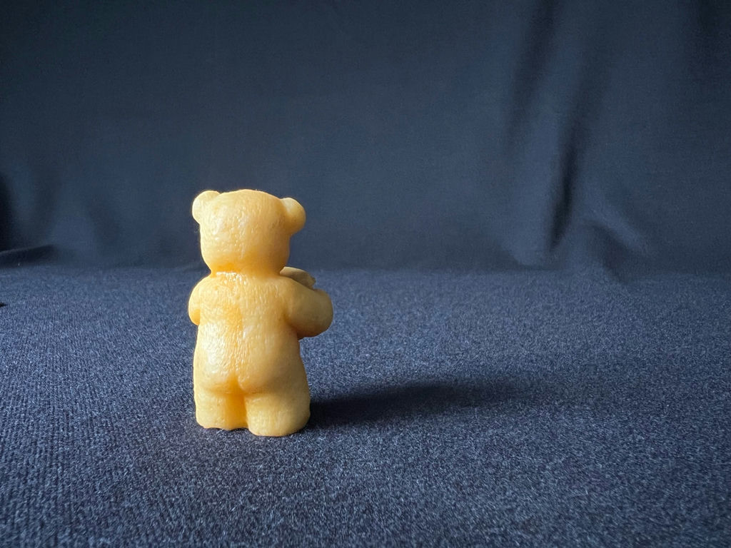 Yellow teddy bear figurine holding a honey jar - image 4 of 8
