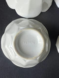 Ceramic dishware set with scalloped bowls and decorative plates - thumbnail 2 of 8